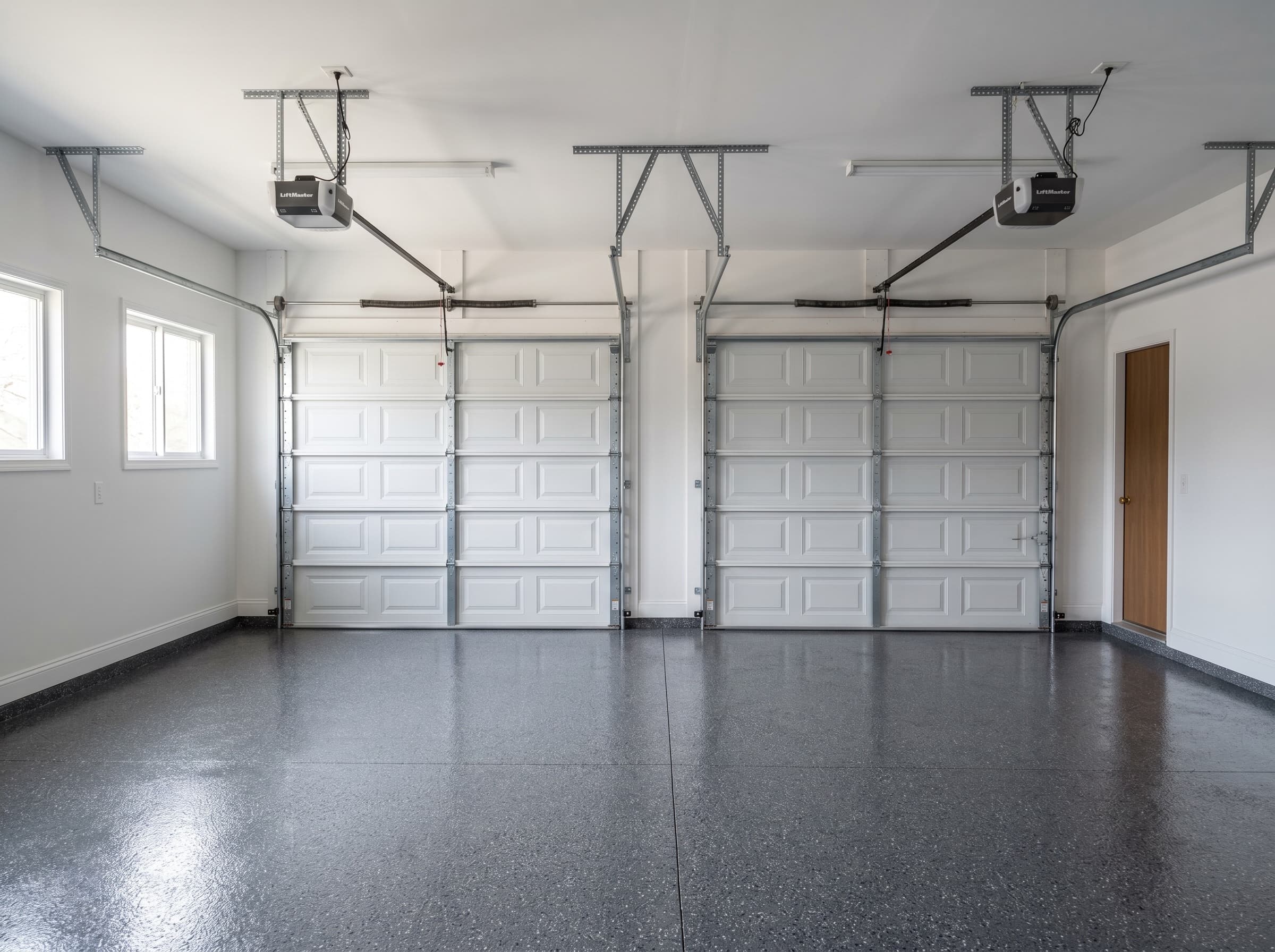 Finished Troy garage with glossy charcoal vinyl-flake epoxy floor.